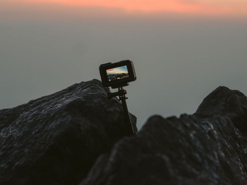 Adventurer using an action camera outdoors